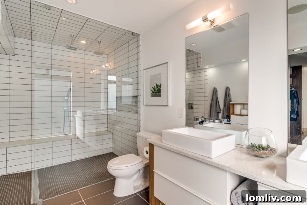 Ensuite bathroom with walk-in shower and dual vanities