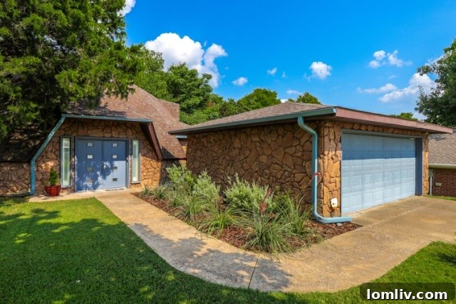 Geodesic Dome Exterior Transformed with Bright Blue Doors and Landscaping