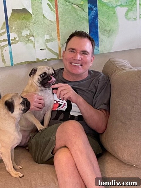 Cliff Ellman, founder of Spiffidecor, with his essential design assistants, Mia and Luna.