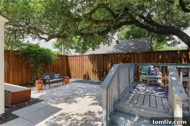 Lush backyard with mature trees and ample space for outdoor activities, offering privacy and natural beauty