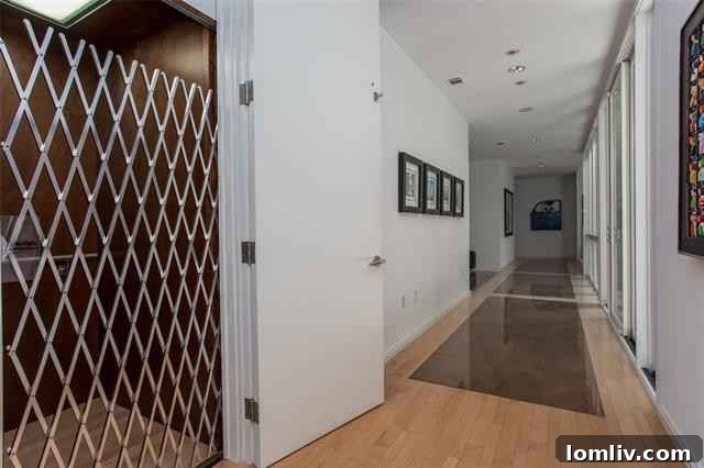 Museum-like staircase and private elevator in a luxury home