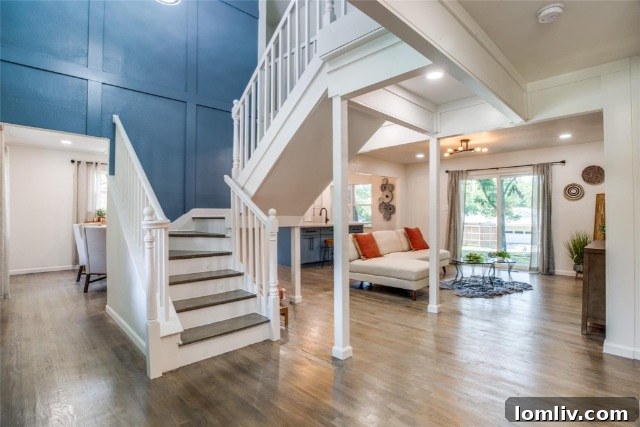 Bright, open-concept and clutter-free living space after Shepherds Construction's home renovation