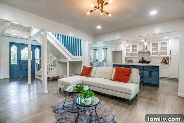 Newly renovated open-plan kitchen featuring a large central island and contemporary finishes