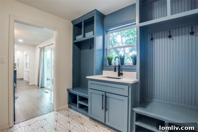 Spacious open concept living and dining area flowing seamlessly after home remodel