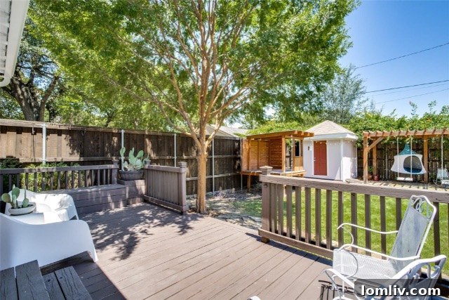 Elegant built-in shelving alongside a fireplace in the living room of a Winnetka Heights Craftsman home