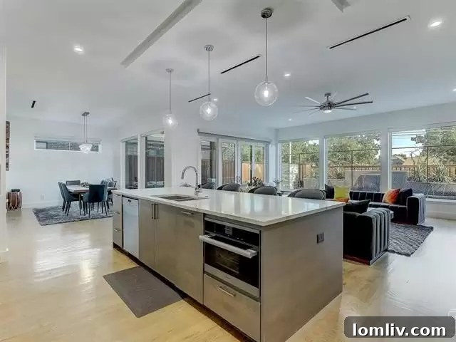 Elegant Dining Area with Contemporary Lighting in Open Concept Layout