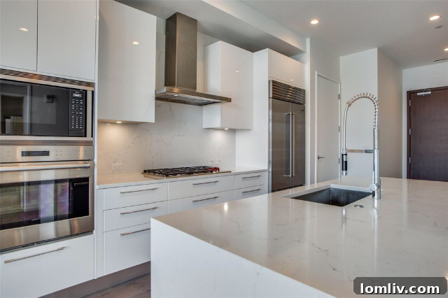 Interior of a one-bedroom Unit 605, showcasing modern kitchen and living space in Windrose Tower