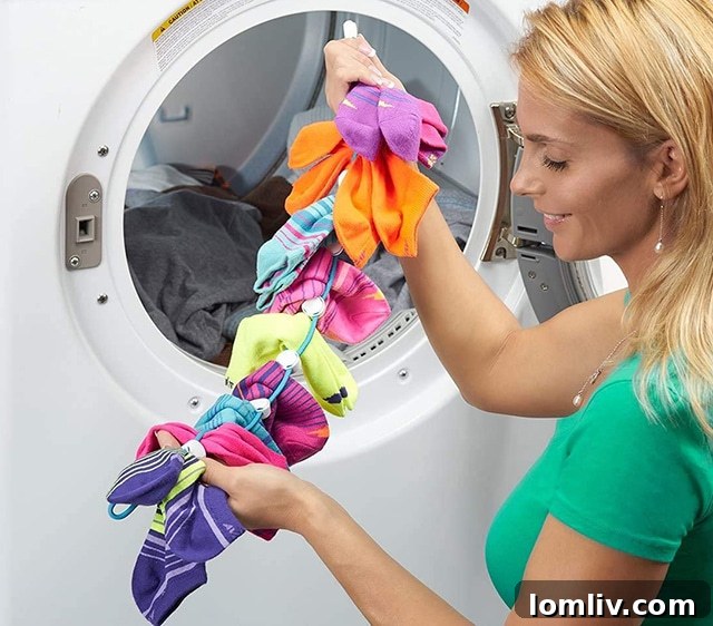 SockDock Laundry Tool holding multiple pairs of socks, ready for washing