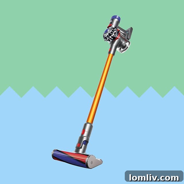 Person cleaning a floor with a lightweight Dyson V8 Cordless Vacuum Cleaner