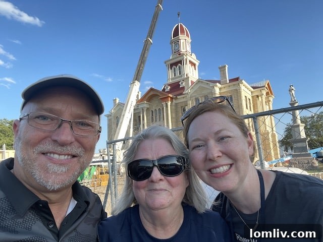 David Chase and Anne Stimmel of Architexas with librarian Barbara McCutcheon, standing proudly before the courthouse.