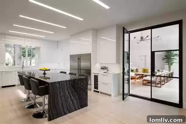 Modern Kitchen with White Lacquer Cabinetry and Granite Island