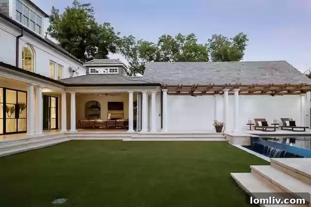 Negative Edge Pool with Waterfall in Backyard Oasis