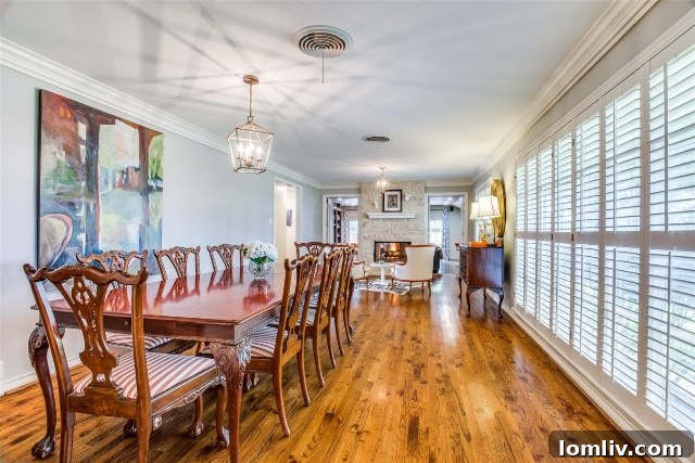 Elegant Formal Dining Room with Fireplace and Cozy Sitting Area