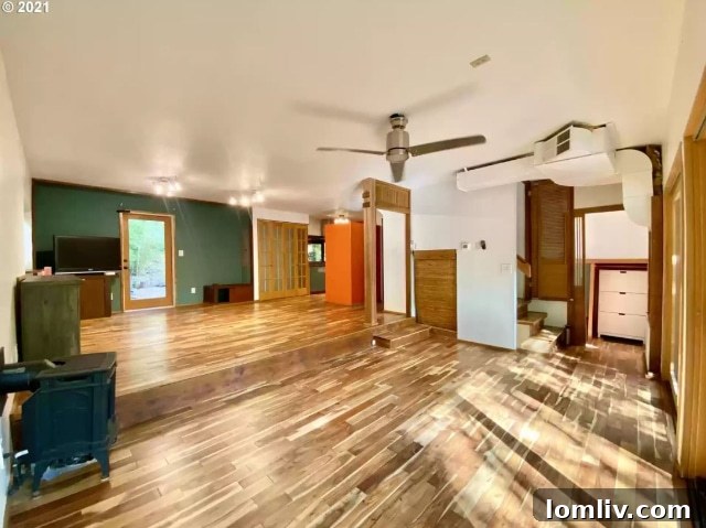 A narrow doorway with a single, steep step leading up to it, creating an awkward and potentially hazardous access point, exemplifying a poor DIY design choice.