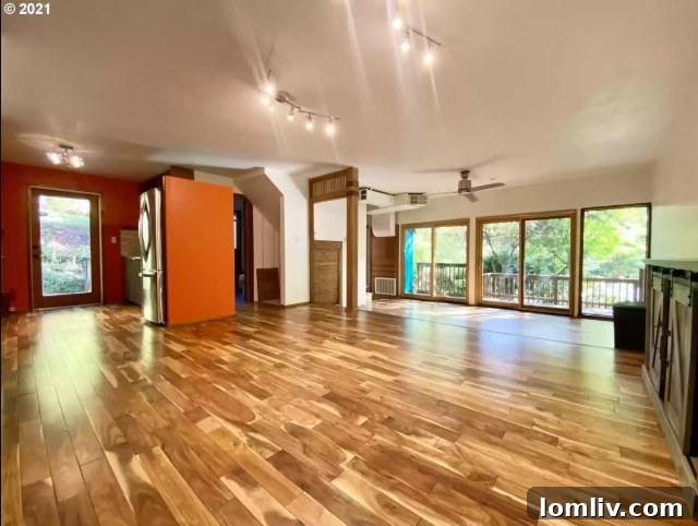 An interior view showing a strangely elevated doorway with a single, high step, reminiscent of an ill-conceived design and questionable structural choices.