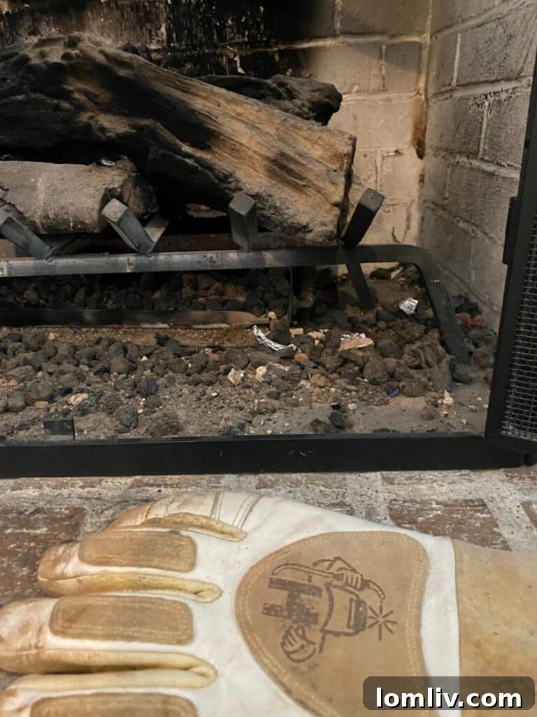 Seen It All? These Homes Are Certified Hot Messes 4 Dangerous fireplace operation requiring reaching through fire to turn off gas, highlighting severe safety hazard.