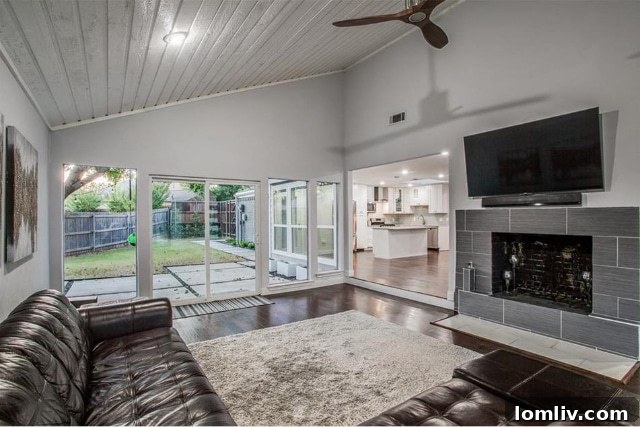 Open concept living room with modern fireplace and ample natural light