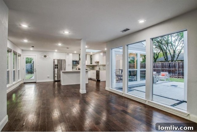 Gourmet kitchen with granite countertops, stainless steel appliances, and a gas range