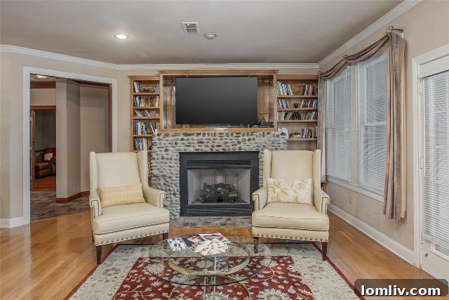 Inviting family room of 6620 Trinity Heights Blvd, featuring a magnificent stone fireplace, perfect for relaxation.