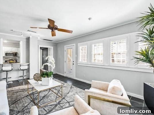 The Mockingbird Home That Captivated 1939 6 Chic kitchen with granite countertops, subway tile backsplash, and stainless steel appliances