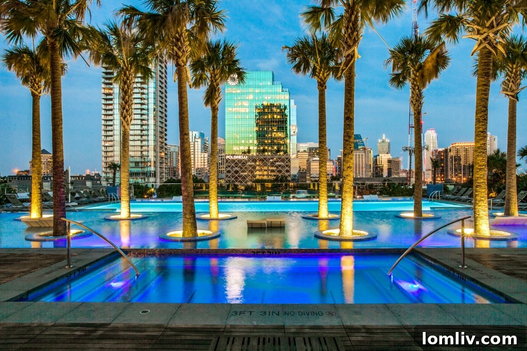 Bleu Ciel Dallas resort-style infinity pool overlooking the city skyline at dusk