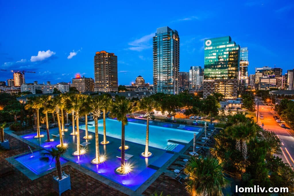 Bleu Ciel Dallas outdoor pool deck with two junior Olympic-sized pools and city skyline views