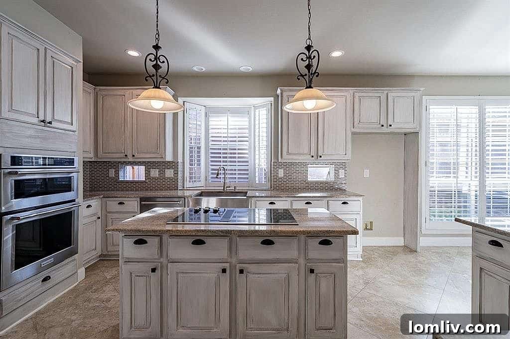 Modern kitchen with high-end granite countertops and KitchenAid appliances in 1325 Lakewood Drive
