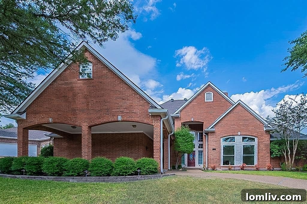 Grand porte cochere entrance of 1110 Hills Creek Drive, a custom home in Stonebridge Ranch