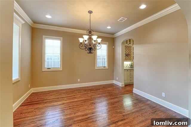 Elegant living room with fireplace and French windows at 5604 Collinwood Avenue