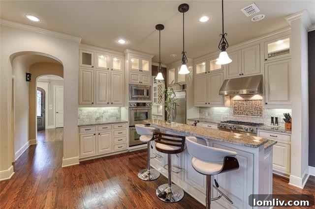 Modern kitchen with ample cabinetry and professional appliances overlooking living area