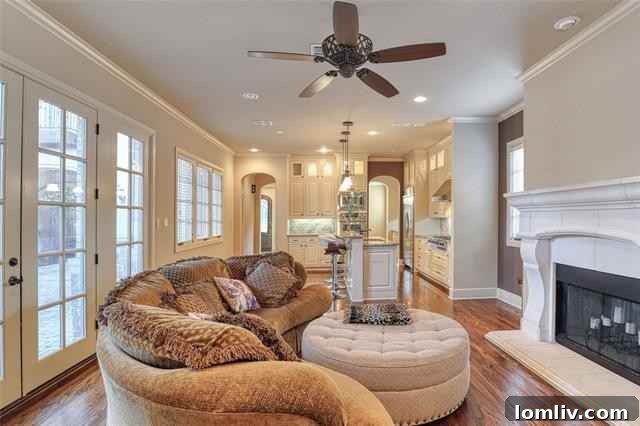 Spacious kitchen island with seating and modern light fixtures