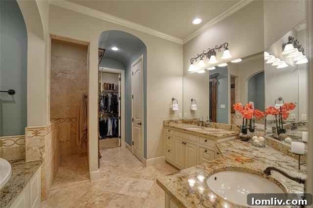 Luxurious primary bathroom with garden tub, separate shower, and dual vanities