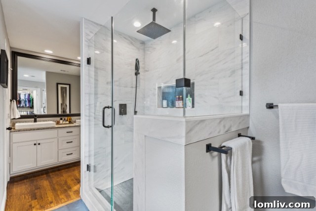 Spa-like primary bathroom featuring a deep soaking tub and spacious walk-in shower