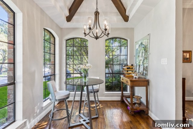 Modern crisp white kitchen with ample counter space and large windows