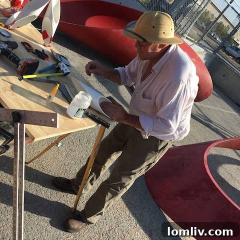Michael van Enter meticulously working on the Alexander Liberman sculpture