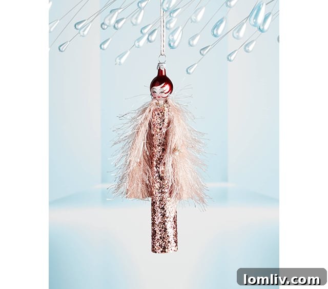 Elegant lady ornament in a glitter dress and feather jacket from Neiman Marcus