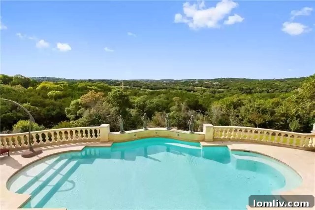 A breathtaking twilight view of the Escala estate, showcasing its illuminated pool and expansive outdoor living spaces.