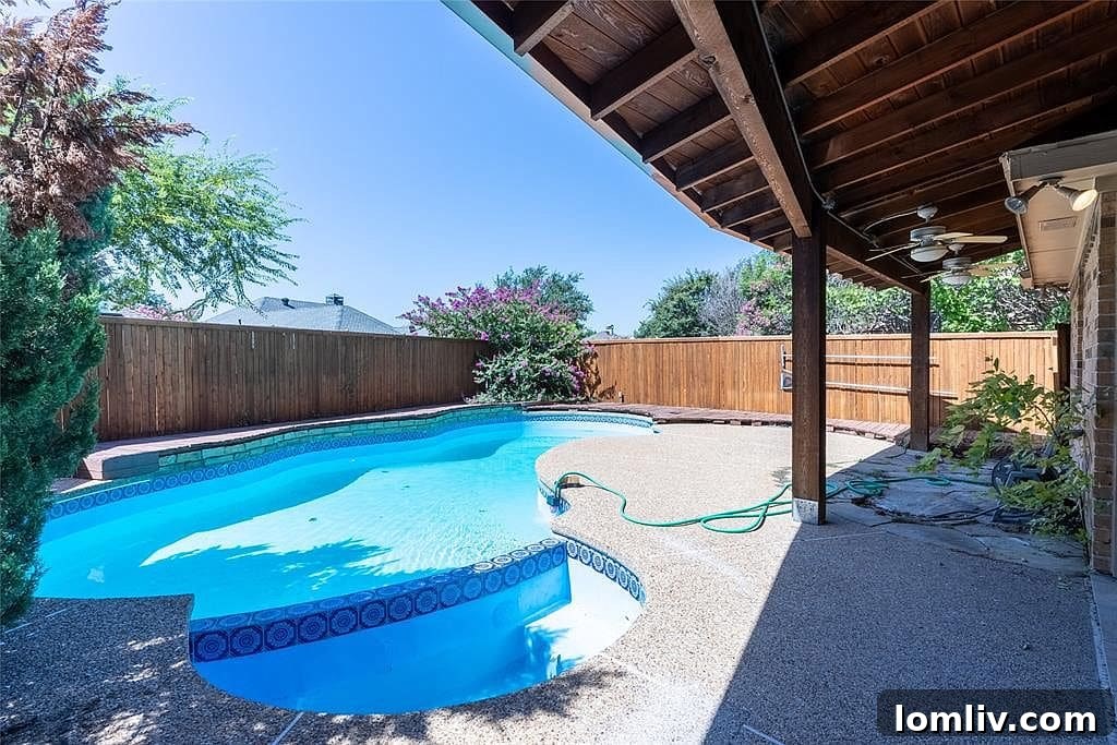Pool and covered patio in the backyard of 4456 Odessa Circle Plano