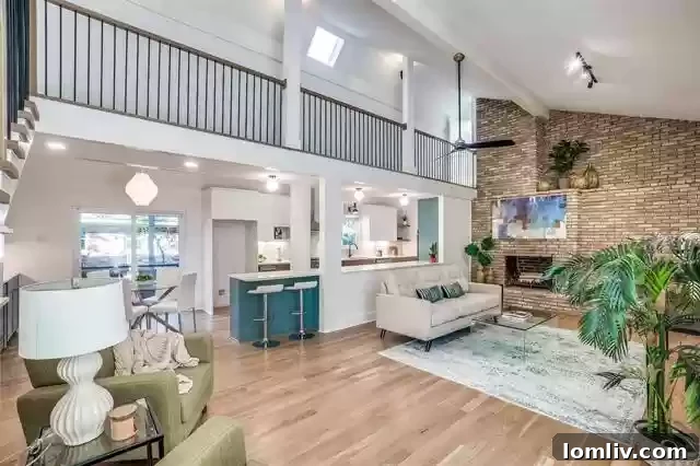 After renovation: Modern open kitchen with island and dining area