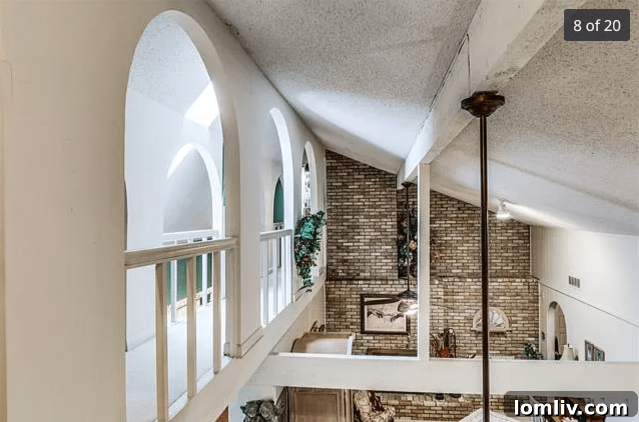 Before renovation: Original living area with dated decor