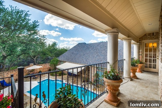 Modern kitchen with dark cabinetry, stainless steel appliances, and a large island