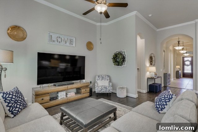 Modern kitchen with light cabinetry, granite countertops, and stainless steel appliances