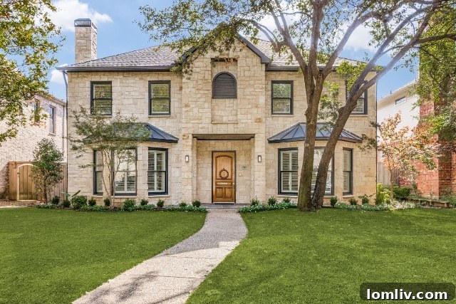 Elegant white brick facade of a University Park home with manicured landscaping
