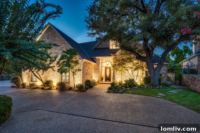 Elegant home exterior with European architectural influences and meticulously manicured lawn
