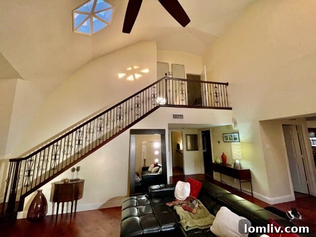 Interior view revealing the two-story structure of the geodesic dome house.