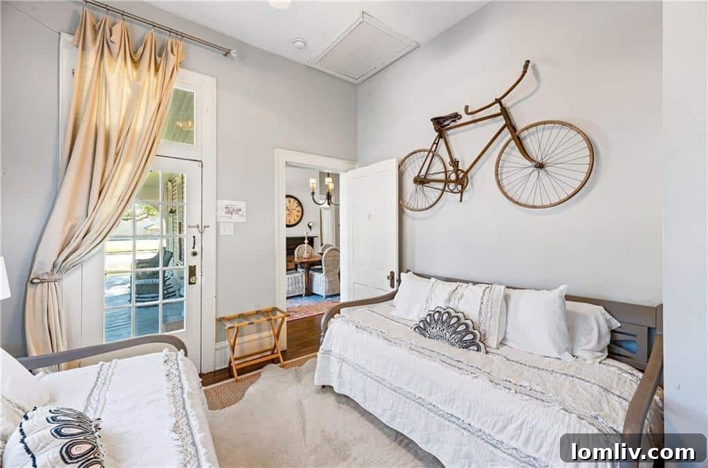 Interior view showcasing the vintage bicycle mounted on the wall, a distinctive design element that gives the Fixer Upper home its 'Bicycle House' name.