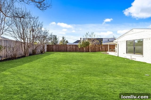 Charming covered back porch, perfect for relaxation and outdoor entertaining in the private backyard.
