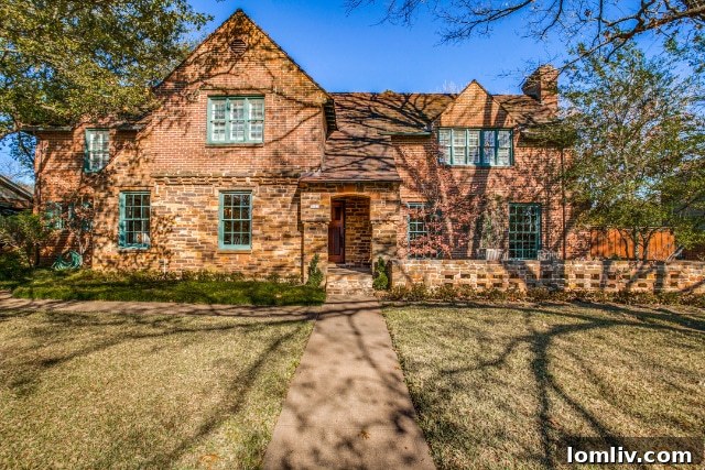 Grand exterior view of the Stevens Park Tudor home, showcasing its distinctive architectural features and well-maintained facade.