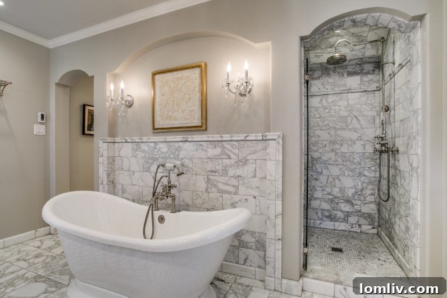 A closer view of the elegant marble details and high-end fixtures in the principal ensuite bathroom.