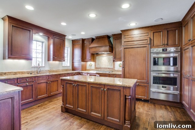 The modern gourmet kitchen, equipped with a Fulgor five-burner gas stove, double ovens, and a convenient warming drawer.